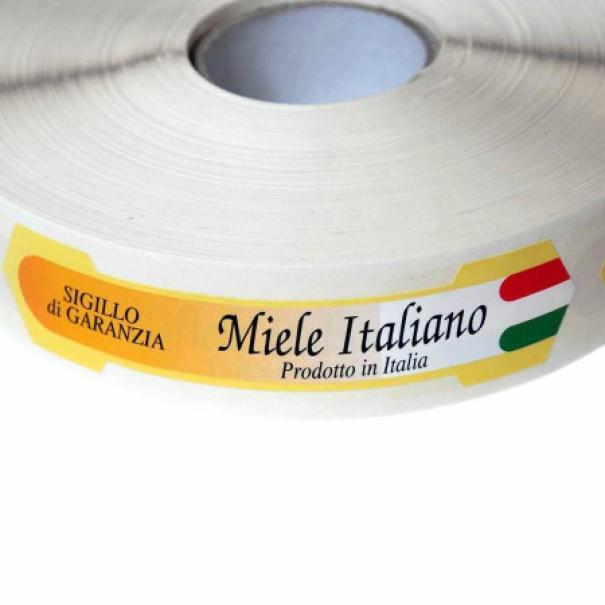 dettaglio etichetta autoadesiva sigillo di garanzia miele italiano con bandiera italiana su rotolo Apicoltura com